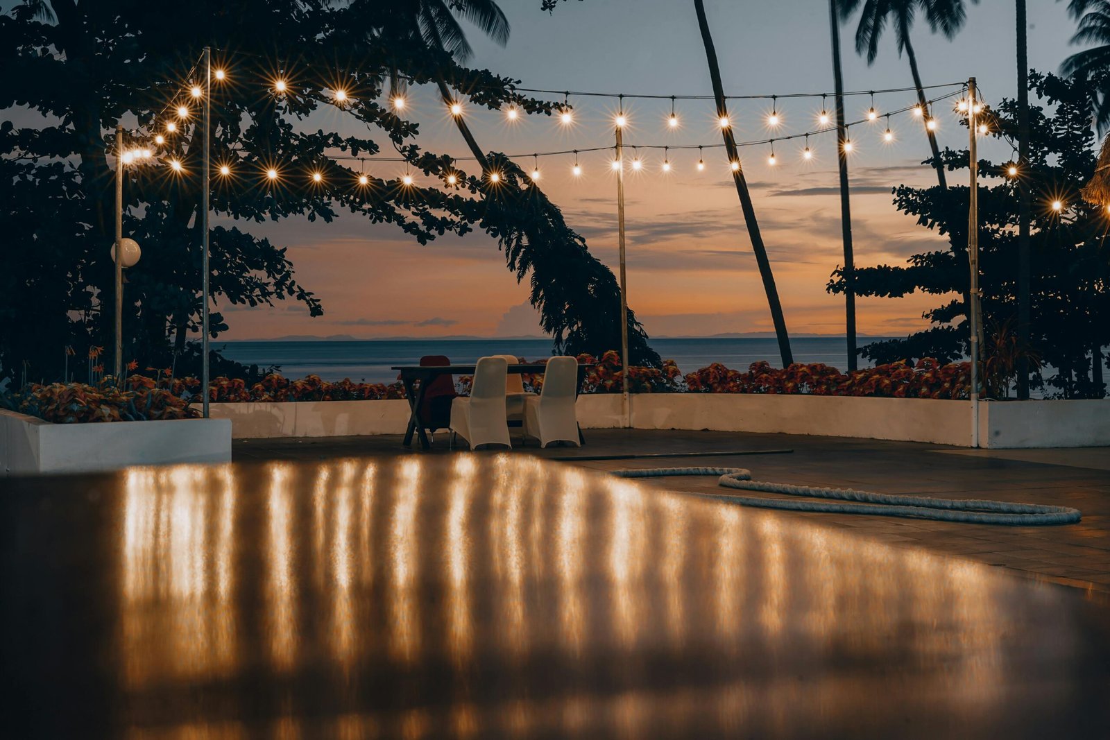 A serene patio view with string lights at sunset in Biak, Papua, Indonesia.