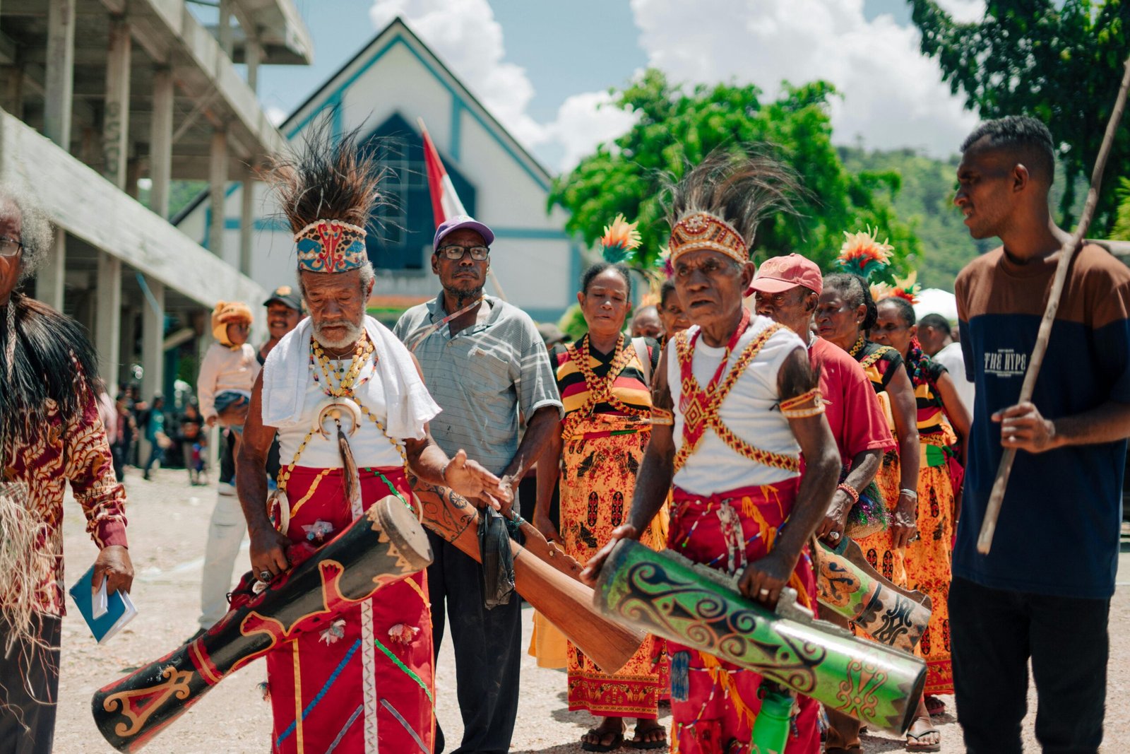 Celebration with traditional costumes in Papua, showcasing rich cultural heritage.