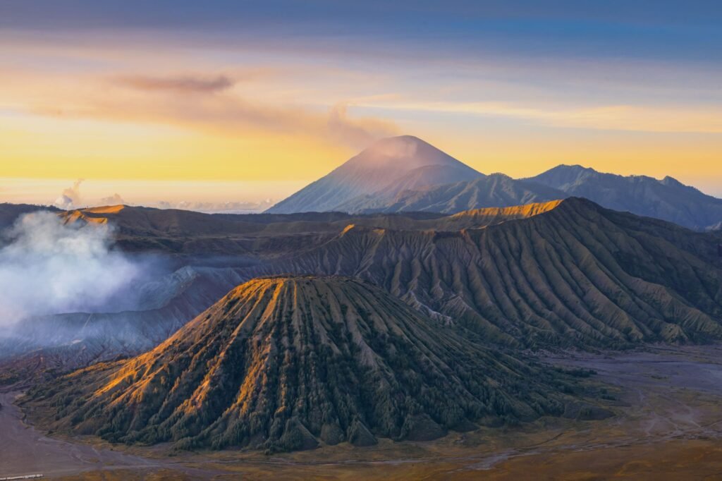 Breathtaking view of Mount Bromo at sunrise showcasing volcanic landscape in Indonesia.